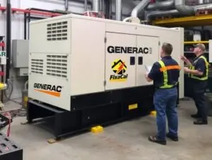 alt: Irvine, CA electricians inspecting generator with checklist for backup power