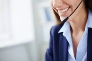 alt="Smiling woman with headset offering free electrical consultation in Irvine, CA"