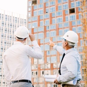 alt: Licensed electricians analyzing commercial building project in Orange County – FixaCal electrical services in Irvine, CA